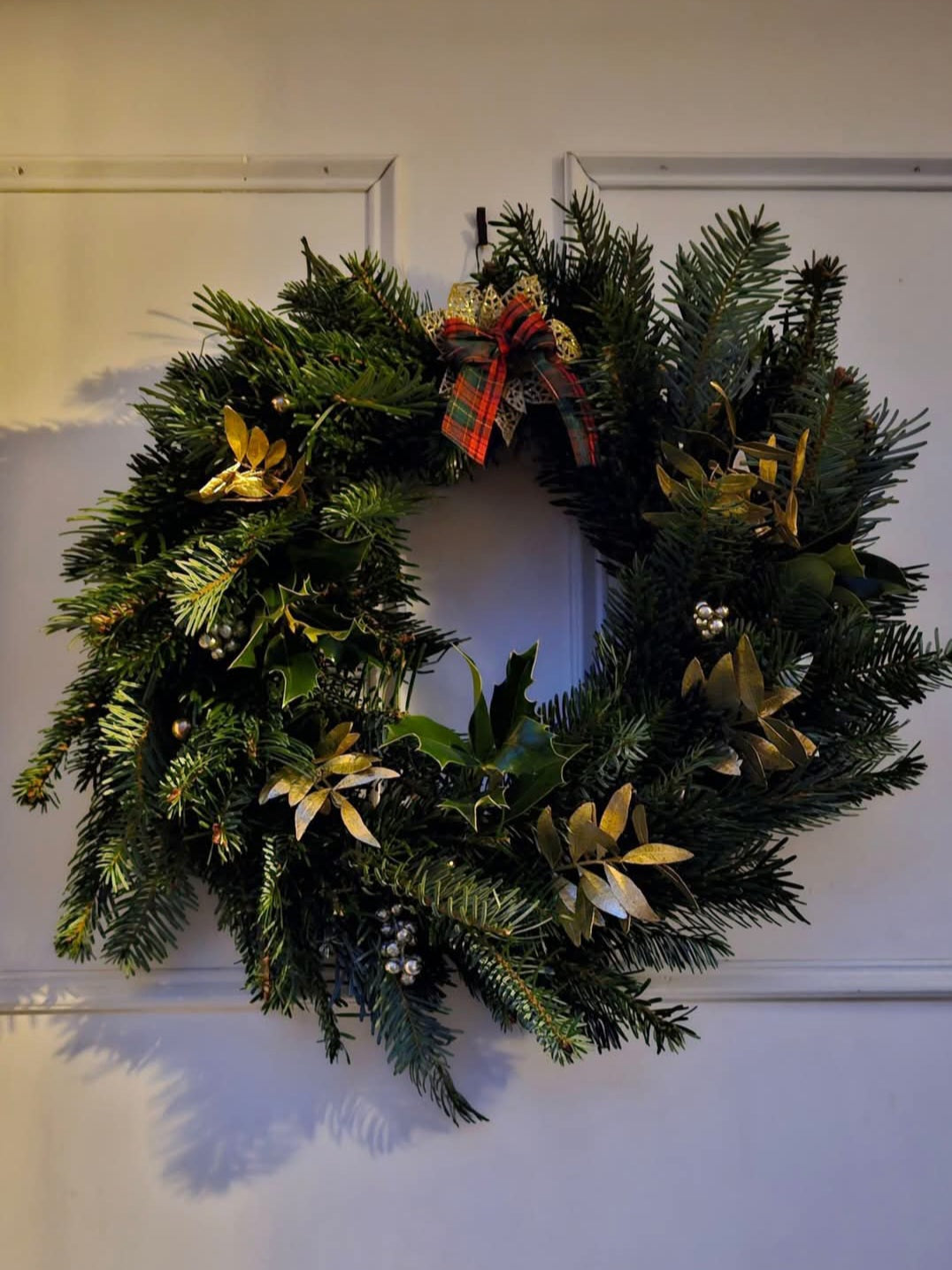 What are our real christmas door wreaths made of?