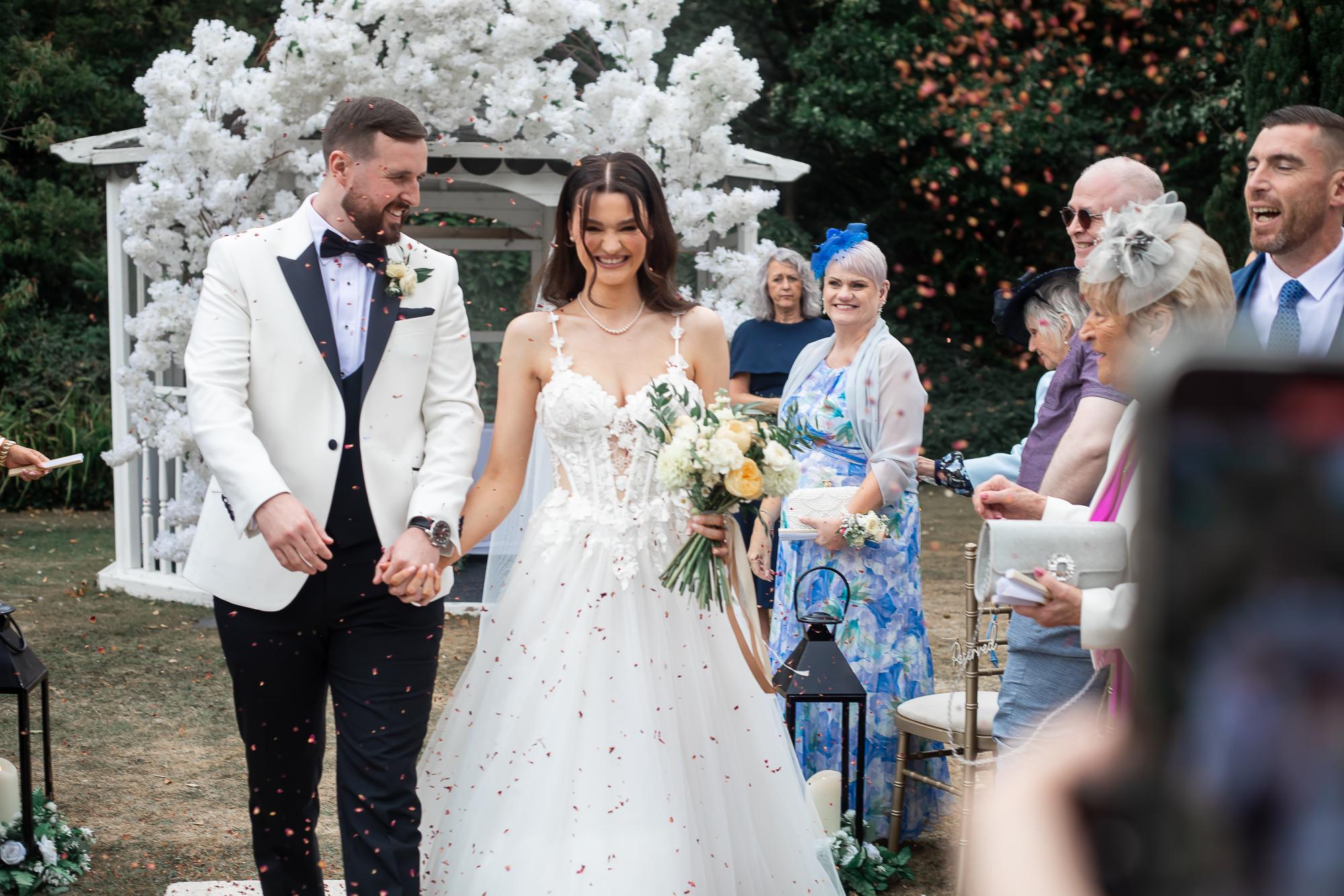 Bridal flowers, groom suit flowers, mother of the bride corsage, all in buttery yellow flowers for chester wedding at crabwall manor