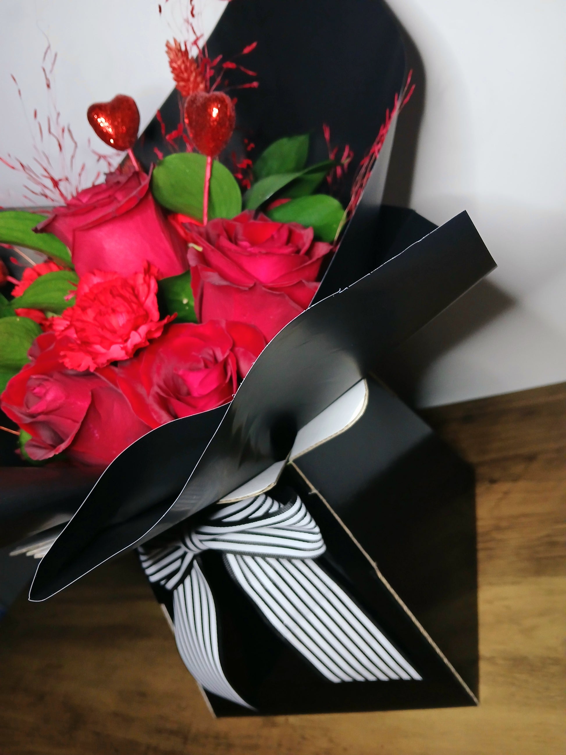 Bouquet of red roses for Valentines day with decorative elements for delivery to all Wirral addresses 